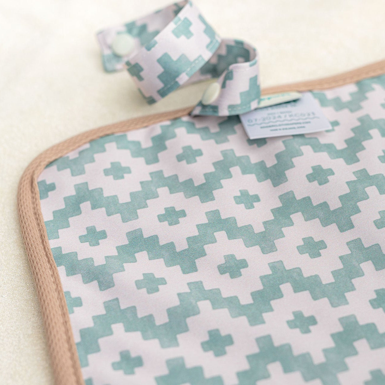 Patterned fabric with a geometric design on a plain background