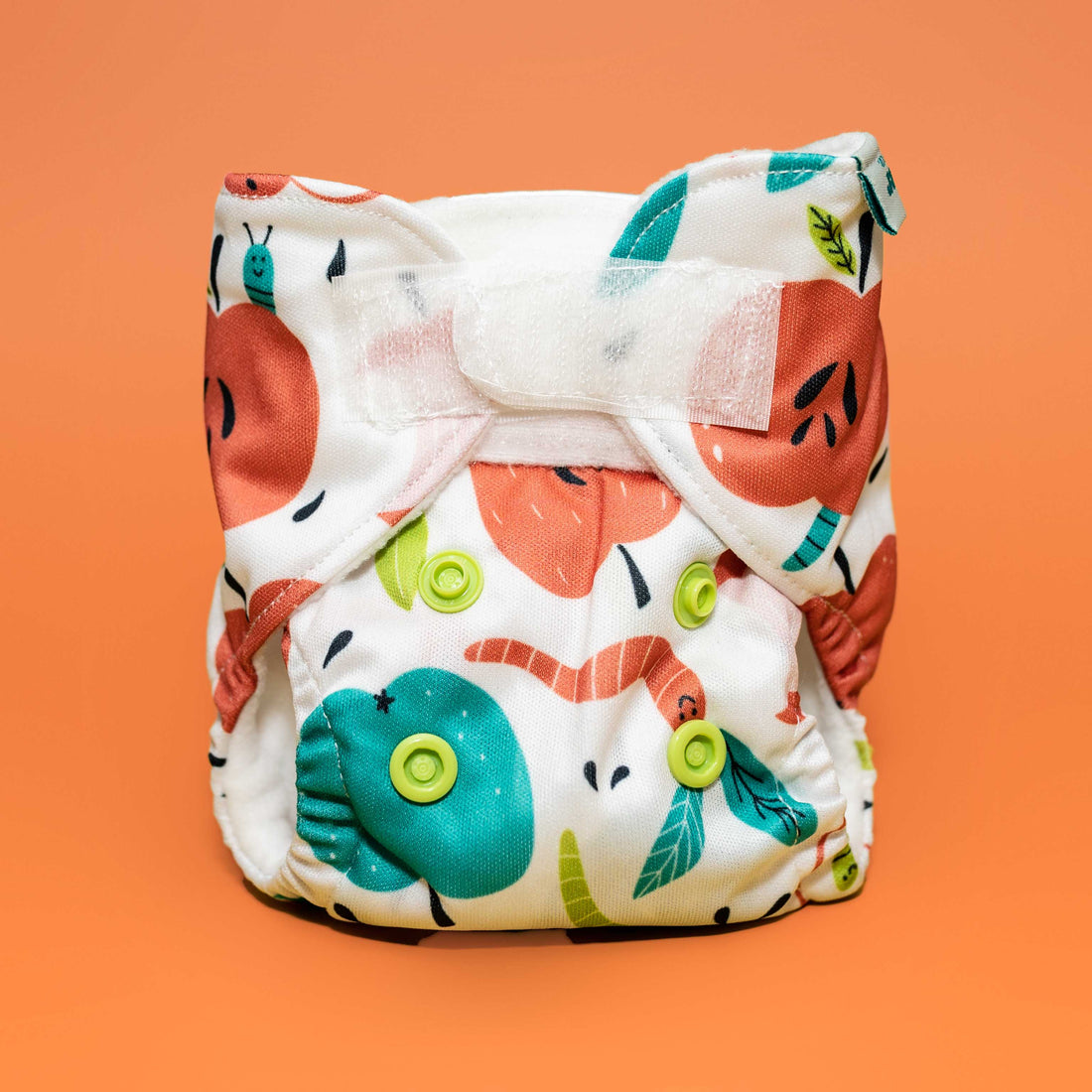 pretend play reusable doll baby diapers fits most dolls and stuffies machine washable cloth diaper apples worms whimsical playful print
