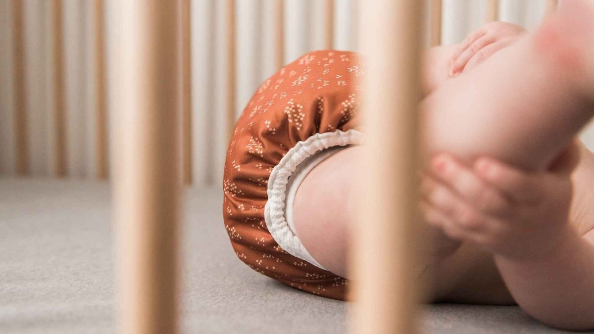 Baby wearing reusable cloth diaper cover best overnight cloth diapering solutions for a leak free fit