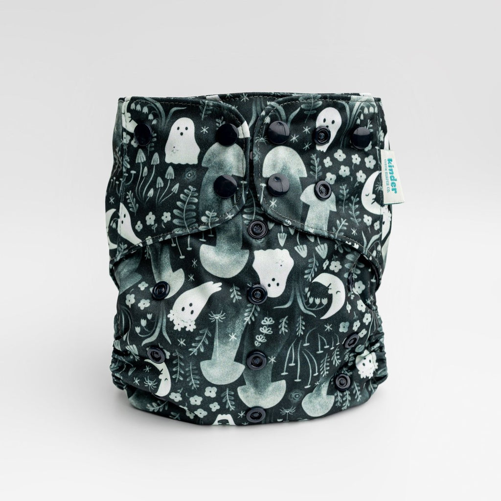 black cloth diaper with whimsical ghosts in the garden with black snaps by kinder cloth diaper co with art by Malika Buttinger, one size fits most