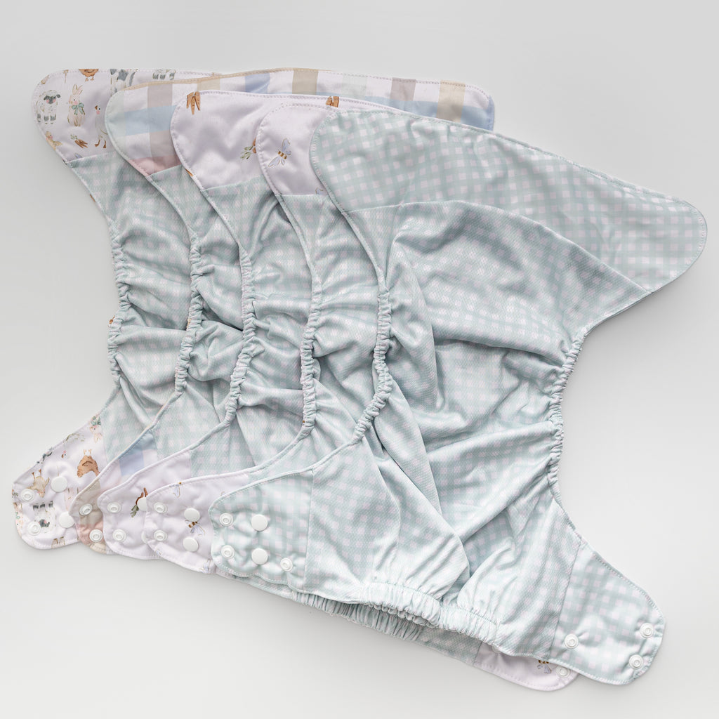 Abstract: Essentials Pocket Cloth Diaper with Athletic Wicking Jersey, Grows with your Baby