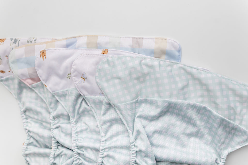 Abstract: Essentials Pocket Cloth Diaper with Athletic Wicking Jersey, Grows with your Baby