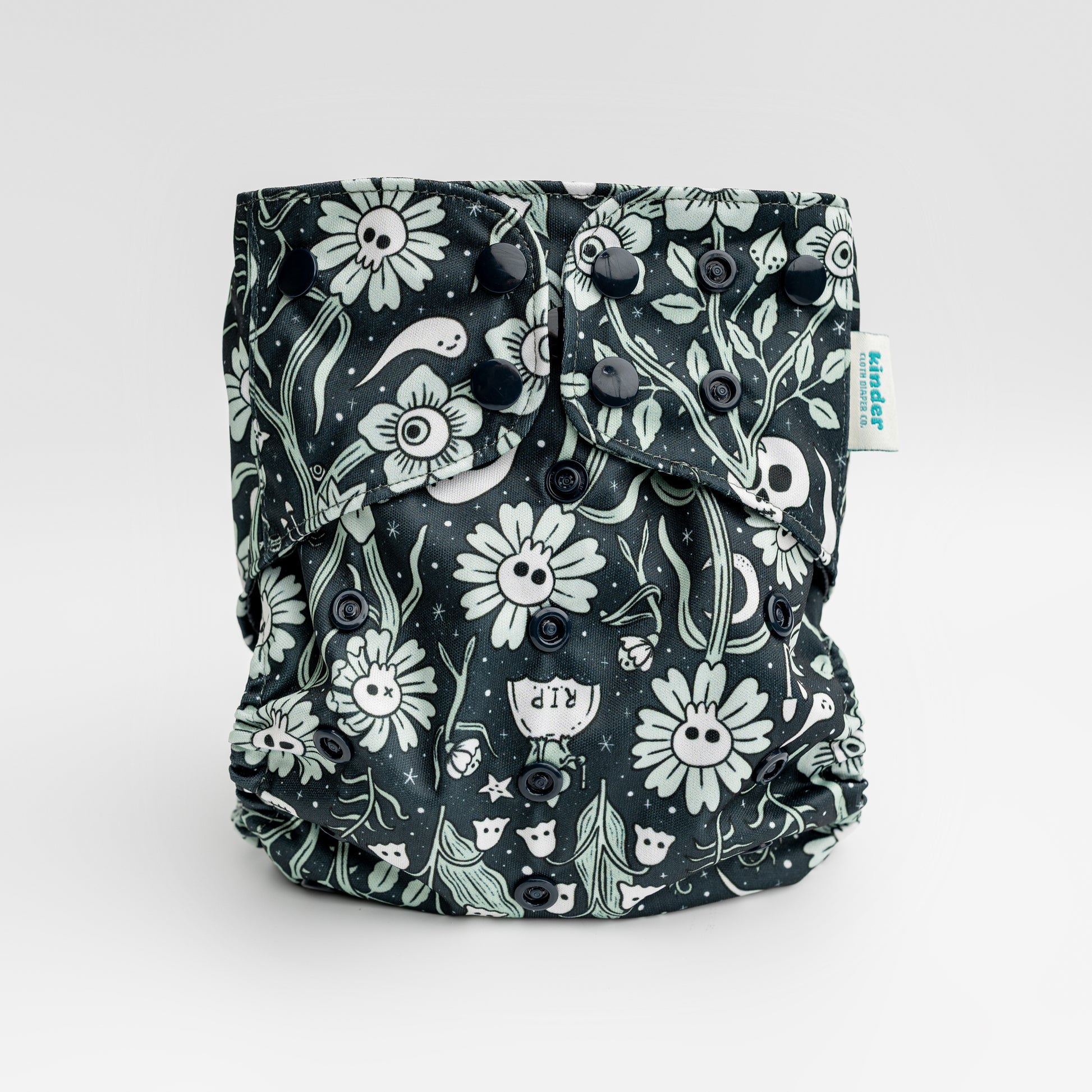 black cloth diaper with whimsical ghosts and mushrooms with black snaps by kinder cloth diaper co with art by Malika Buttinger, one size fits most