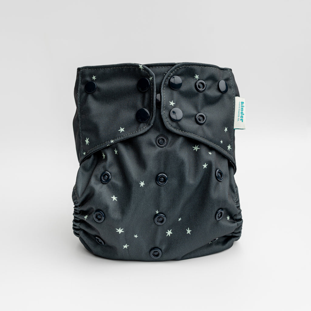 our best selling pocket diaper with in black with tiny green stars black snaps by kinder cloth diaper co, one size fits most