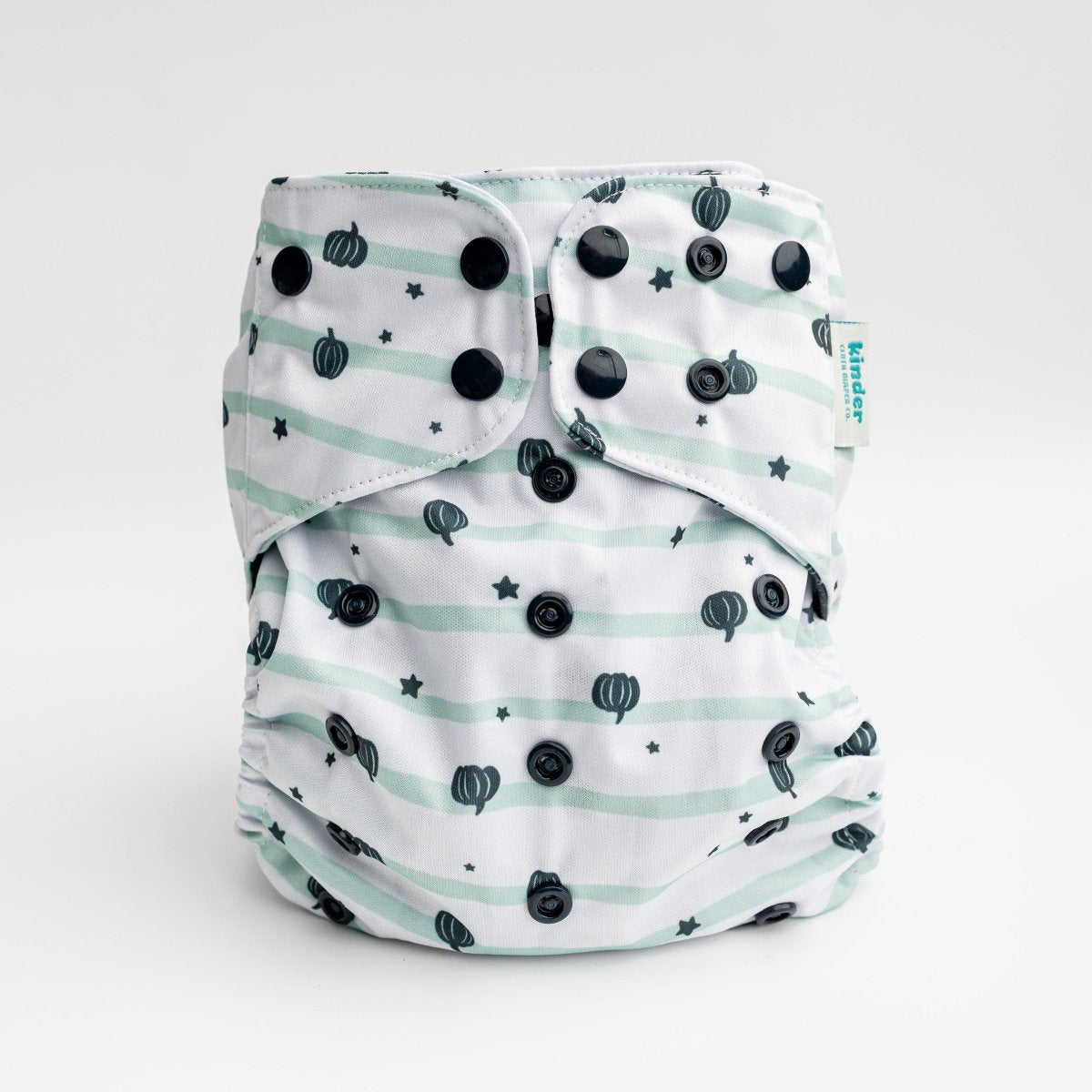 a five star white pocket diaper with tiny green pumpkins black snaps by kinder cloth diaper co, one size fits most