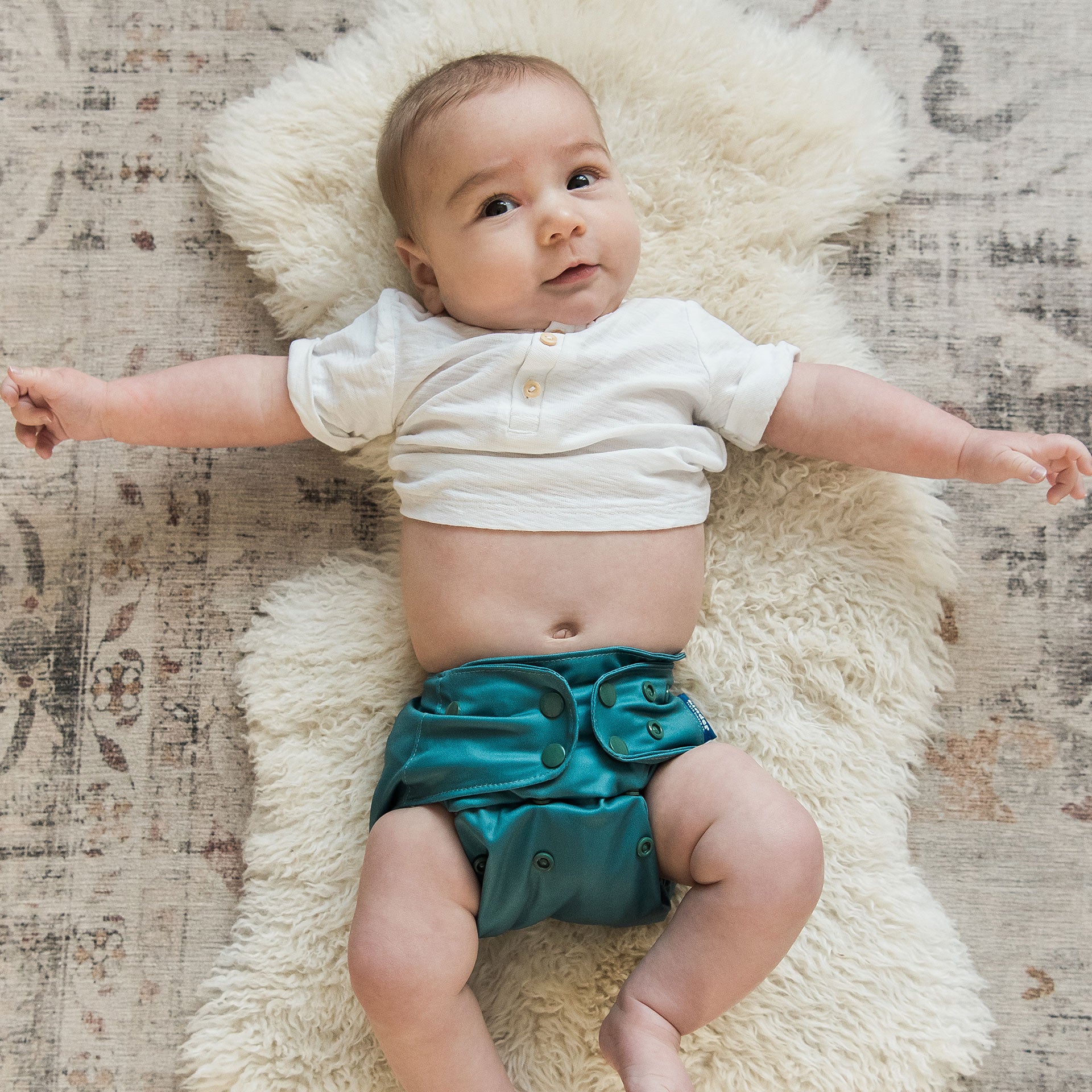 modern reusable diapers for babies from birth to potty training fits most babies from seven to sixty pounds machine washable cloth diapers with athletic wicking jersey teal blue gender neutral baby registry gift for cloth diapering families