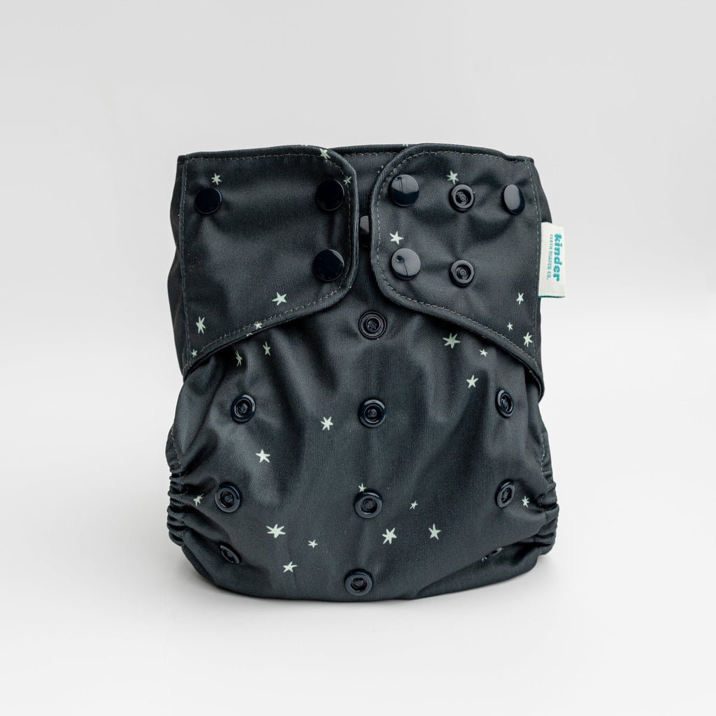 our best selling pocket diaper with in black with tiny green stars black snaps by kinder cloth diaper co, one size fits most