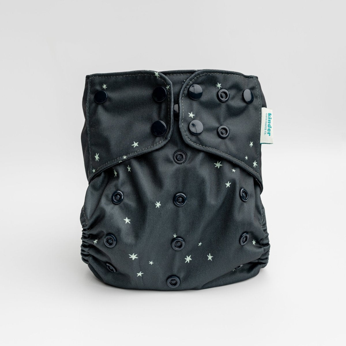 our best selling pocket diaper with in black with tiny green stars black snaps by kinder cloth diaper co, one size fits most